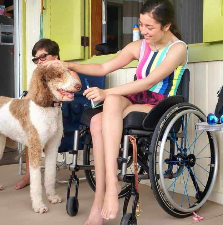 girl in wheelchair with service dog